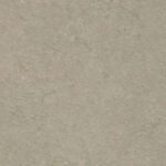 A textured, light gray surface with a subtle, mottled pattern fills the entire space, resembling stone or concrete, without any text or distinct features.