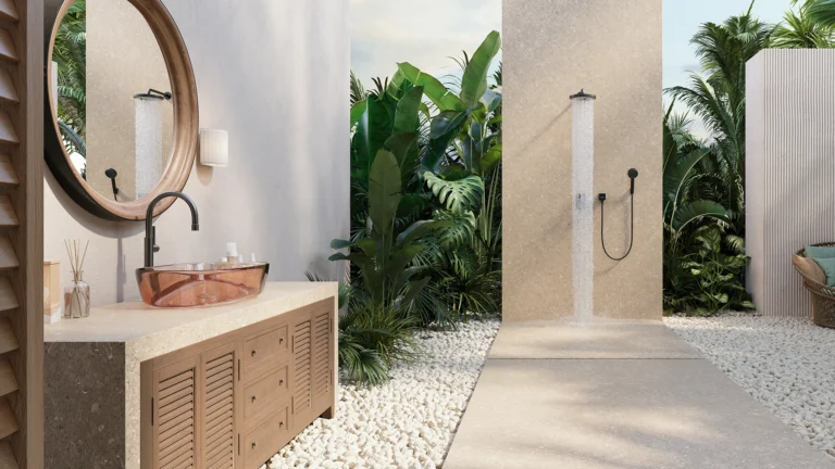 Caesarstone Porcelain 546 Thalassa in Outdoor shower area with plants, stone flooring, wooden vanity, round mirror, and copper sink.